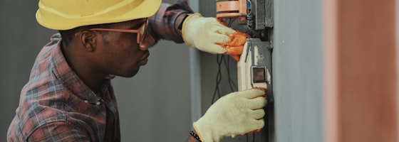 Industrial technician inspecting failing equipment