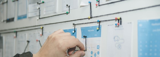 Overwhelmed worker surrounded by unorganized workflow